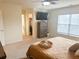 Large main bedroom with king bed, dresser, and TV at 8781 Red Oak Dr, North Charleston, SC 29406