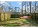Fenced backyard with raised wooden deck and seating area at 9159 Parlor Dr, Ladson, SC 29456