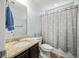 Bathroom with granite vanity and whale-themed shower curtain at 9159 Parlor Dr, Ladson, SC 29456