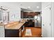 Kitchen with dark brown cabinets, granite counters, and stainless steel appliances at 9159 Parlor Dr, Ladson, SC 29456