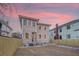 Two-story home with gray siding and a backyard at sunset at 929 Rutledge Ave, Charleston, SC 29403