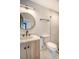 Bathroom with an oval mirror, light wood vanity, and a frameless glass shower at 929 Rutledge Ave, Charleston, SC 29403