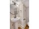 Modern bathroom with pedestal sink and oval mirror at 929 Rutledge Ave, Charleston, SC 29403