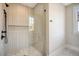 Modern bathroom with a glass-enclosed shower and pebble floor at 929 Rutledge Ave, Charleston, SC 29403
