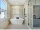 Spa-like bathroom with soaking tub and glass shower at 929 Rutledge Ave, Charleston, SC 29403