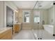 Modern bathroom with walk-in shower and soaking tub at 929 Rutledge Ave, Charleston, SC 29403