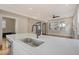 Modern kitchen island with a farmhouse sink and quartz countertops at 929 Rutledge Ave, Charleston, SC 29403