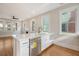 Modern kitchen island with quartz countertops and stainless steel dishwasher at 929 Rutledge Ave, Charleston, SC 29403