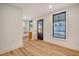 Bright laundry room with black door and windows, offering natural light at 929 Rutledge Ave, Charleston, SC 29403