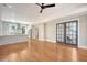 Open living space with hardwood floors, kitchen, and access to the stairs at 929 Rutledge Ave, Charleston, SC 29403