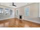 Spacious living room with hardwood floors, fireplace, and large windows at 929 Rutledge Ave, Charleston, SC 29403