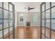 Spacious living room with hardwood floors, fireplace, and french doors at 929 Rutledge Ave, Charleston, SC 29403