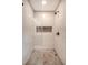 Modern walk-in shower with penny round floor and white subway tile at 929 Rutledge Ave, Charleston, SC 29403