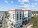 A large building with multiple balconies and a rooftop deck, near the water at 1 King St # 503, Charleston, SC 29401