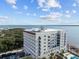 A large building with balconies and a rooftop deck, overlooking the water at 1 King St # 503, Charleston, SC 29401