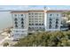 Large building overlooking the water, featuring balconies and a rooftop deck at 1 King St # 503, Charleston, SC 29401
