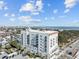 Large building with balconies and a rooftop deck, overlooking the water and city at 1 King St # 503, Charleston, SC 29401