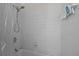 Simple bathroom with shower/tub combination and tiled walls at 1 King St # 503, Charleston, SC 29401