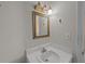 Small bathroom with a vanity sink and mirror at 1 King St # 503, Charleston, SC 29401