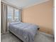 Bright bedroom with neutral walls and soft gray bedding at 1 King St # 503, Charleston, SC 29401