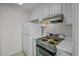 Retro kitchen with white cabinets and vintage appliances at 1 King St # 503, Charleston, SC 29401