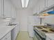 Efficient galley kitchen featuring vintage appliances at 1 King St # 503, Charleston, SC 29401