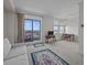 Living room with water view and balcony access at 1 King St # 503, Charleston, SC 29401