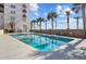 Inviting swimming pool surrounded by palm trees at 1 King St # 503, Charleston, SC 29401