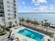 Refreshing swimming pool with palm trees and water views at 1 King St # 503, Charleston, SC 29401