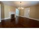 Dining room with hardwood floors, chandelier, and fireplace at 109 Quaker Rd, Saint George, SC 29477