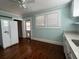 Kitchen with white cabinets, granite counters, and hardwood floors at 109 Quaker Rd, Saint George, SC 29477