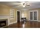 Living room with hardwood floors, fireplace, and built-in shelving at 109 Quaker Rd, Saint George, SC 29477