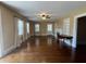 Spacious living room featuring hardwood floors, fireplace, and built-in shelves at 109 Quaker Rd, Saint George, SC 29477
