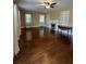 Spacious living room featuring hardwood floors, fireplace, and built-in shelves at 109 Quaker Rd, Saint George, SC 29477