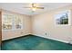 Bedroom with teal carpet and two windows at 116 Eagle Dr, Summerville, SC 29485