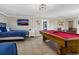 Basement with pool table, twin beds and TV at 1308 Palmetto Blvd Blvd, Edisto Beach, SC 29438