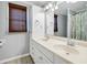 Bathroom with double vanity, shower, and linen closet at 1308 Palmetto Blvd Blvd, Edisto Beach, SC 29438