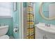 Small bathroom with shower, toilet, and pedestal sink at 1308 Palmetto Blvd Blvd, Edisto Beach, SC 29438
