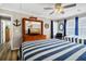 Nautical-themed bedroom with twin beds, dresser, and TV at 1308 Palmetto Blvd Blvd, Edisto Beach, SC 29438