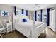Primary bedroom with ocean view and white bedding at 1308 Palmetto Blvd Blvd, Edisto Beach, SC 29438