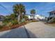 Beach house with palm trees and brick driveway at 1308 Palmetto Blvd Blvd, Edisto Beach, SC 29438