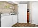 Laundry closet with washer, dryer, and shelving at 1308 Palmetto Blvd Blvd, Edisto Beach, SC 29438