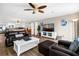 Living room with leather sofas, white coffee table, and hardwood floors at 1308 Palmetto Blvd Blvd, Edisto Beach, SC 29438