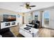 Ocean-view living room features hardwood floors, comfortable seating, and a large TV at 1308 Palmetto Blvd Blvd, Edisto Beach, SC 29438