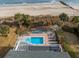 Aerial of pool and deck overlooking the beach at 1308 Palmetto Blvd Blvd, Edisto Beach, SC 29438