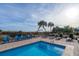 Blue swimming pool with surrounding patio at 1308 Palmetto Blvd Blvd, Edisto Beach, SC 29438