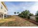Landscaped yard with palm trees and beach access at 1308 Palmetto Blvd Blvd, Edisto Beach, SC 29438