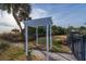 White pergola and manicured lawn with palm trees at 1308 Palmetto Blvd Blvd, Edisto Beach, SC 29438