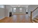 Spacious living room with hardwood floors, fireplace, and large windows at 131 Cantona Dr, Summerville, SC 29483