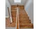 Elegant hardwood staircase with light oak finish and white railing at 131 Cantona Dr, Summerville, SC 29483